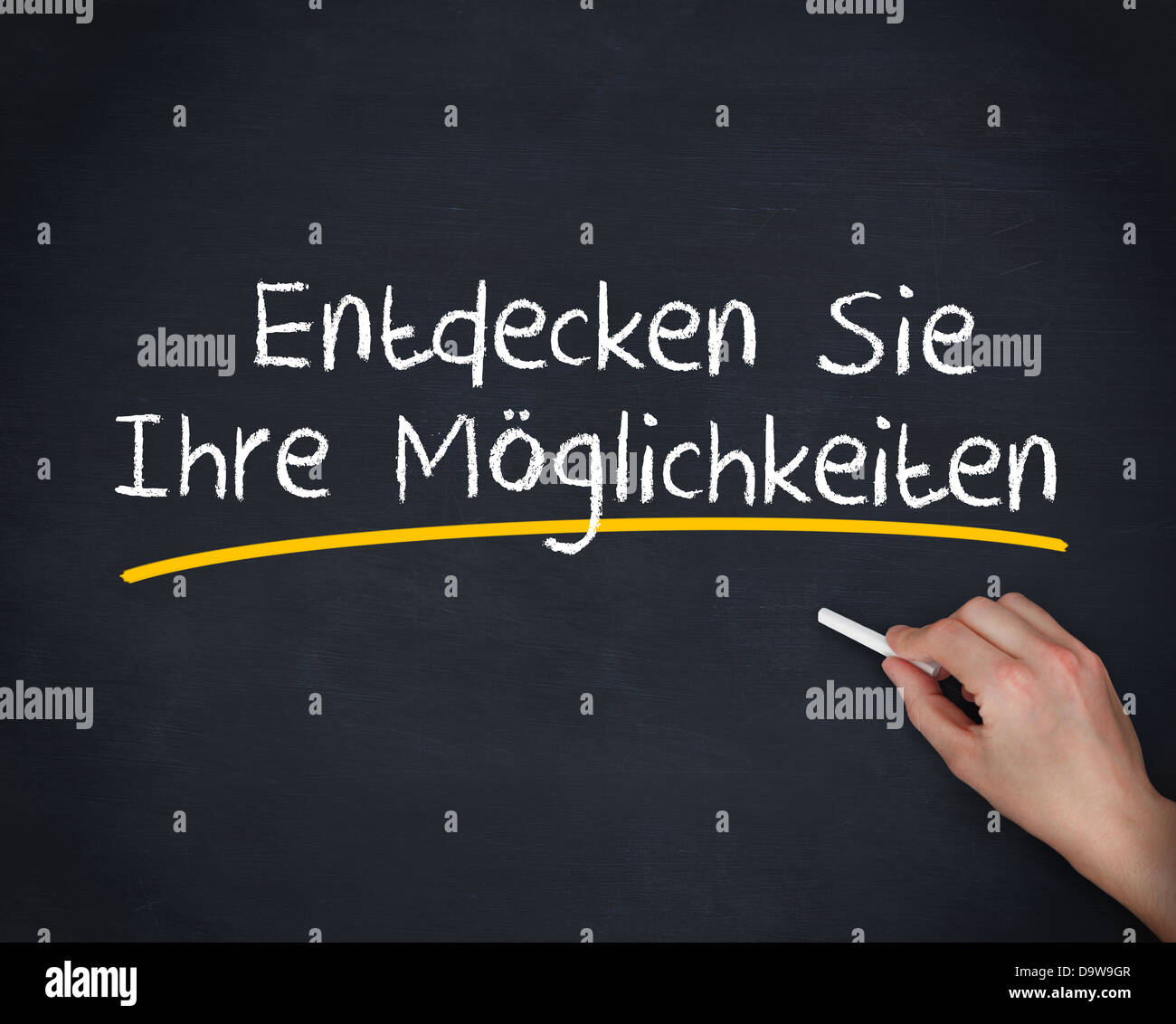 Hand writing entdecken sie ihre moglichkeiten with a chalk Stock Photo