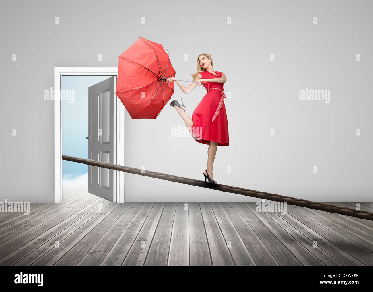 Pretty woman standing on a rope Stock Photo
