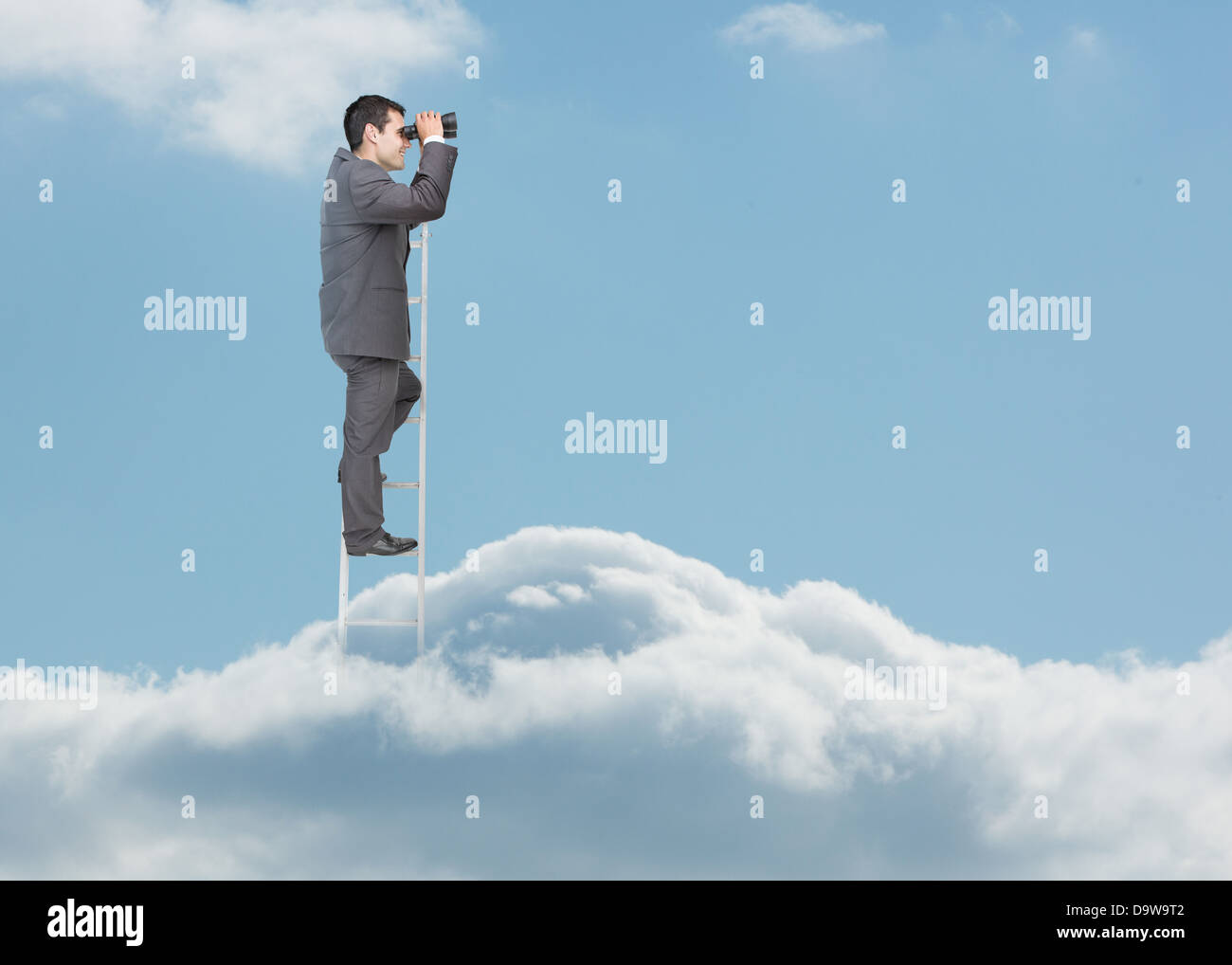 Businessman standing on ladder over the clouds Stock Photo - Alamy