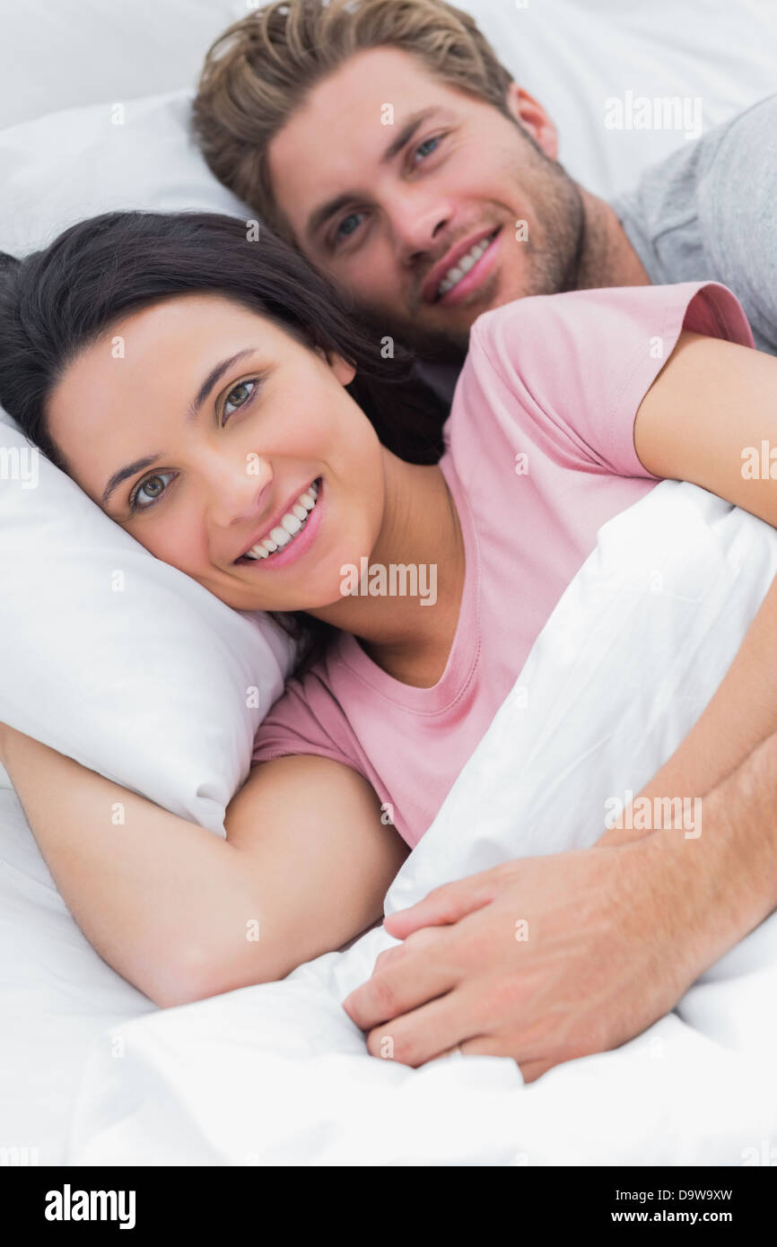 Couple spooning in bed hi-res stock photography and images - Alamy