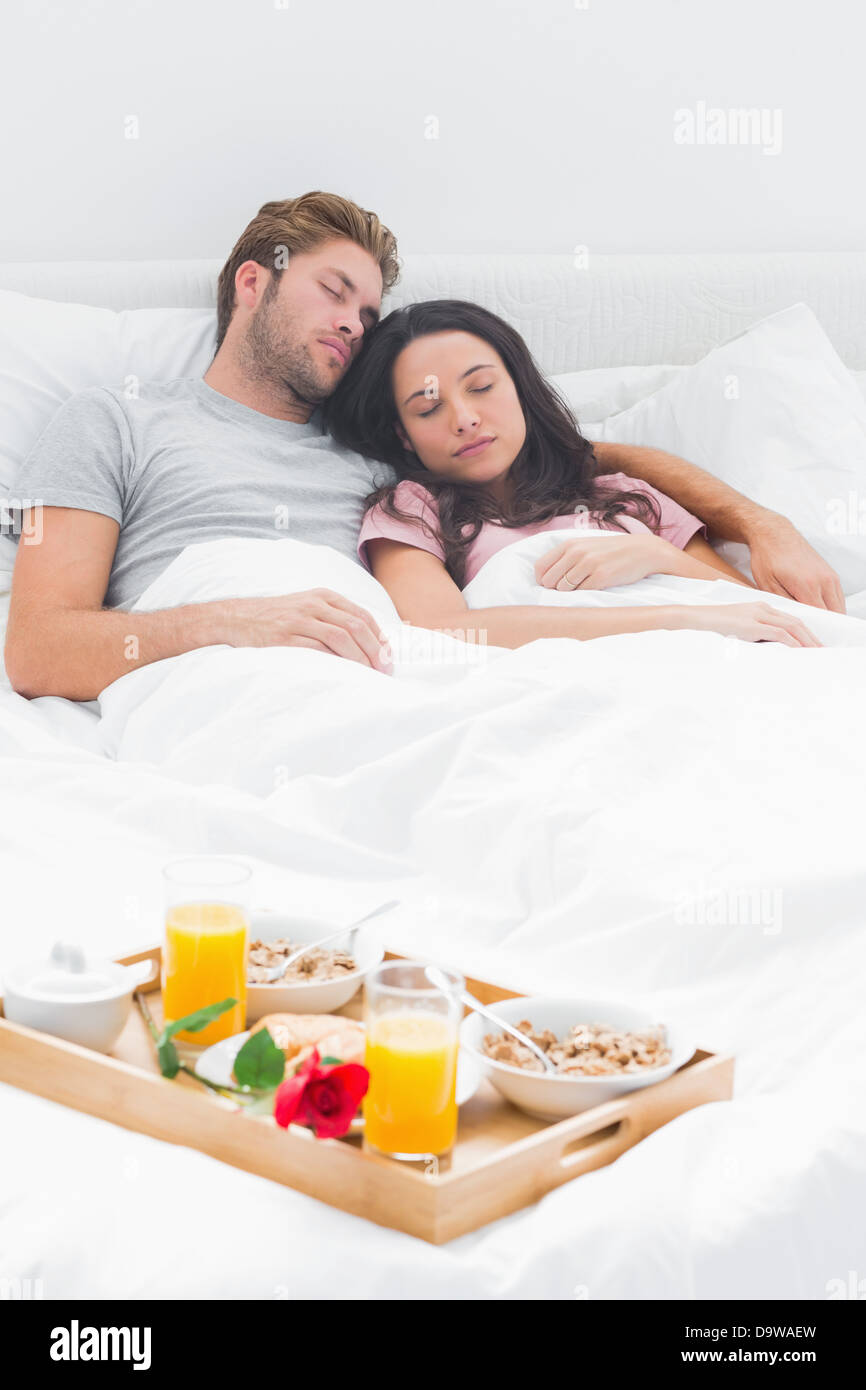 Beautiful couple sleeping in their bed Stock Photo