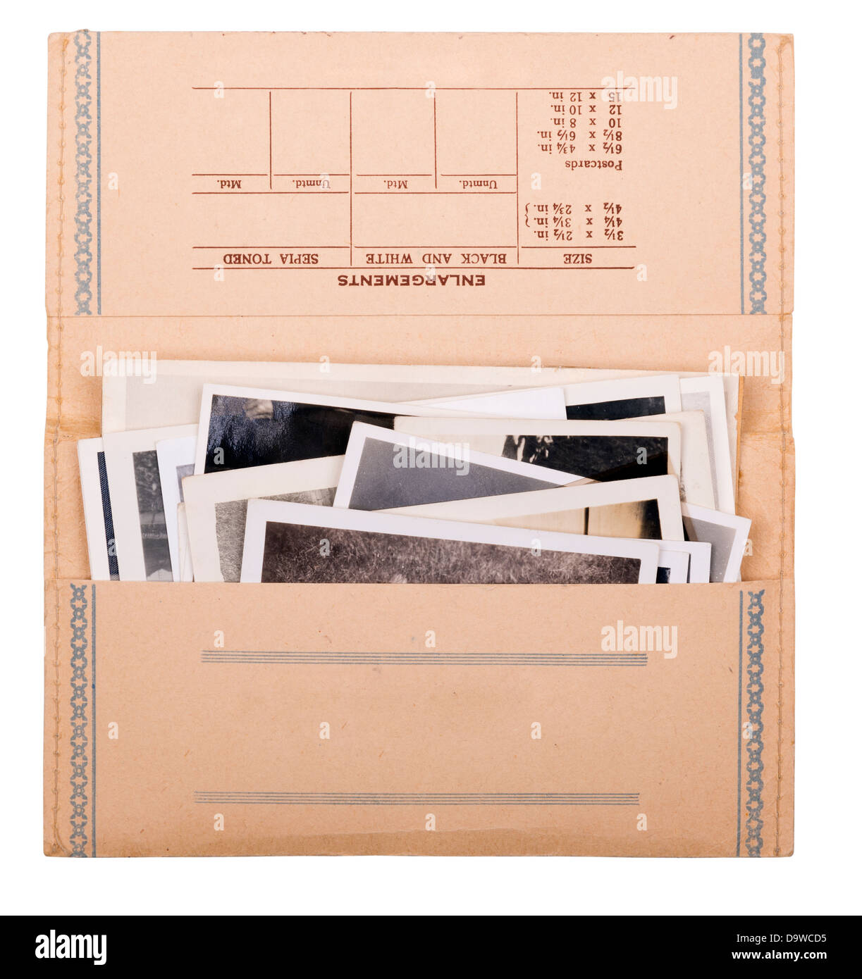 Old black and white photos in a vintage photo wallet isolated on white Stock Photo