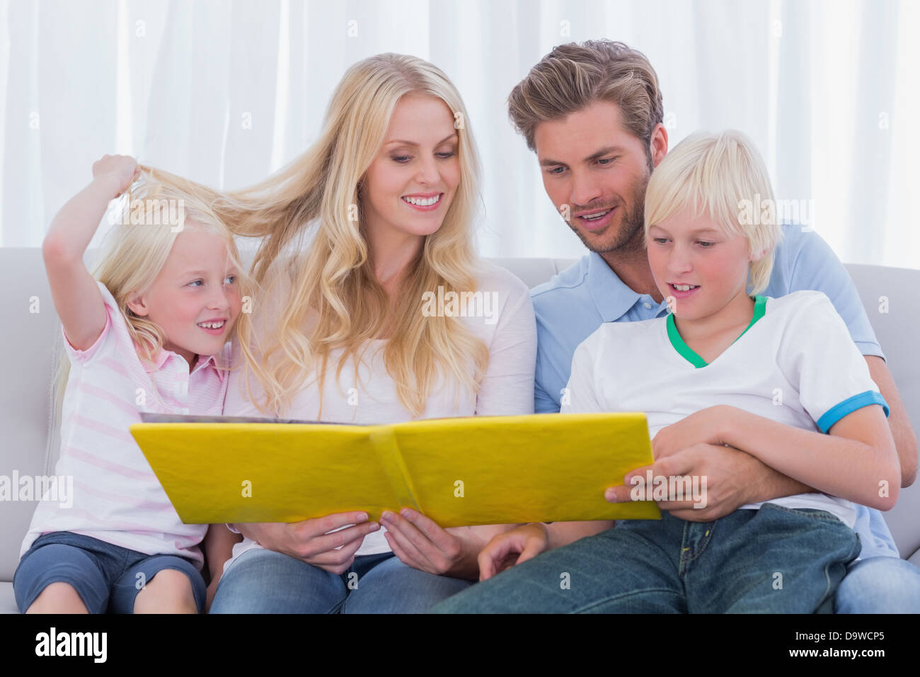 Family reading a story together Stock Photo