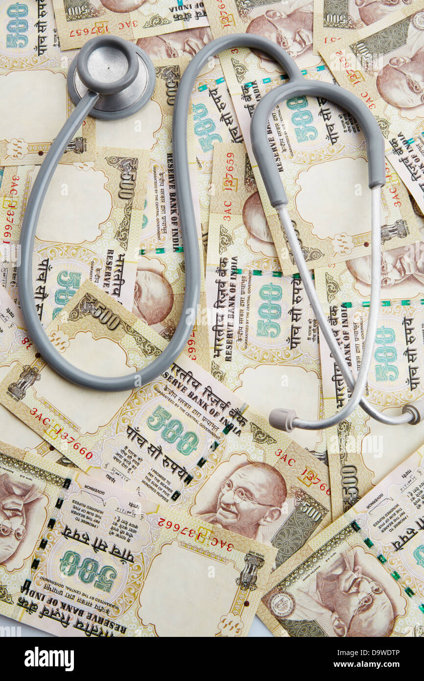 Top view of a stethoscope on Indian five hundred rupee notes Stock