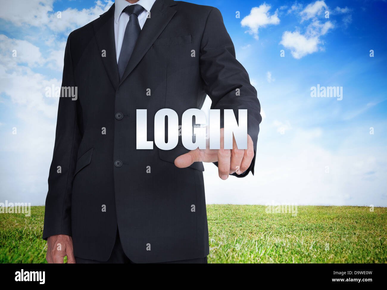 Businessman selecting login word Stock Photo
