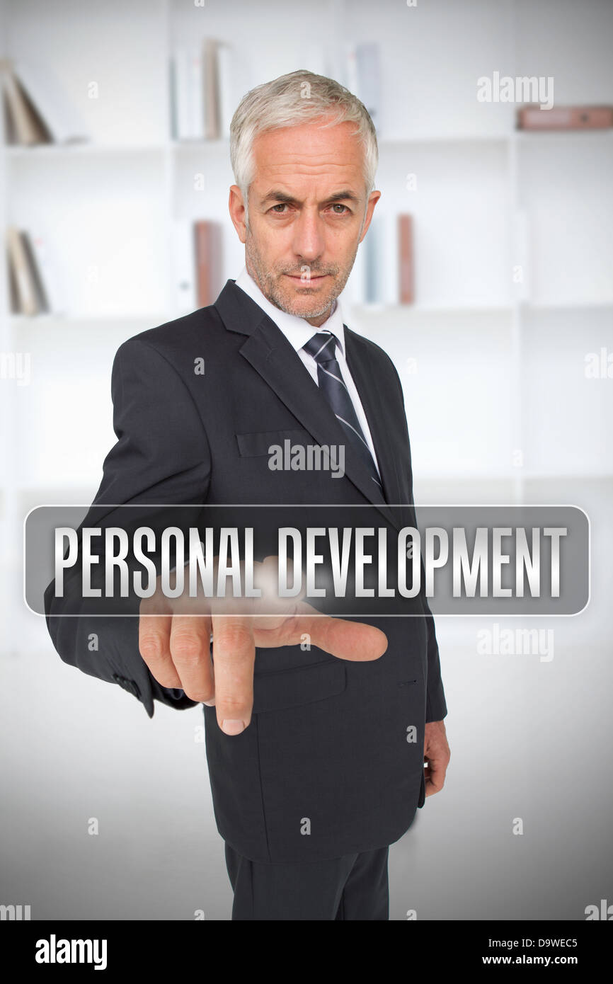 Businessman touching the term personal development Stock Photo
