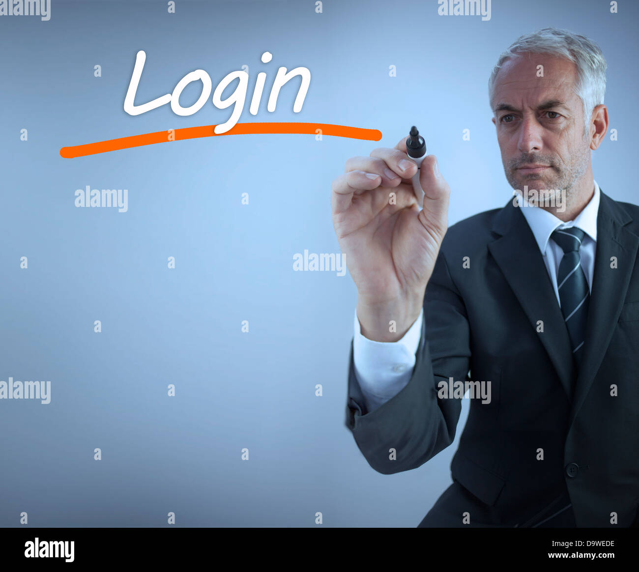 Businessman writing the word login Stock Photo