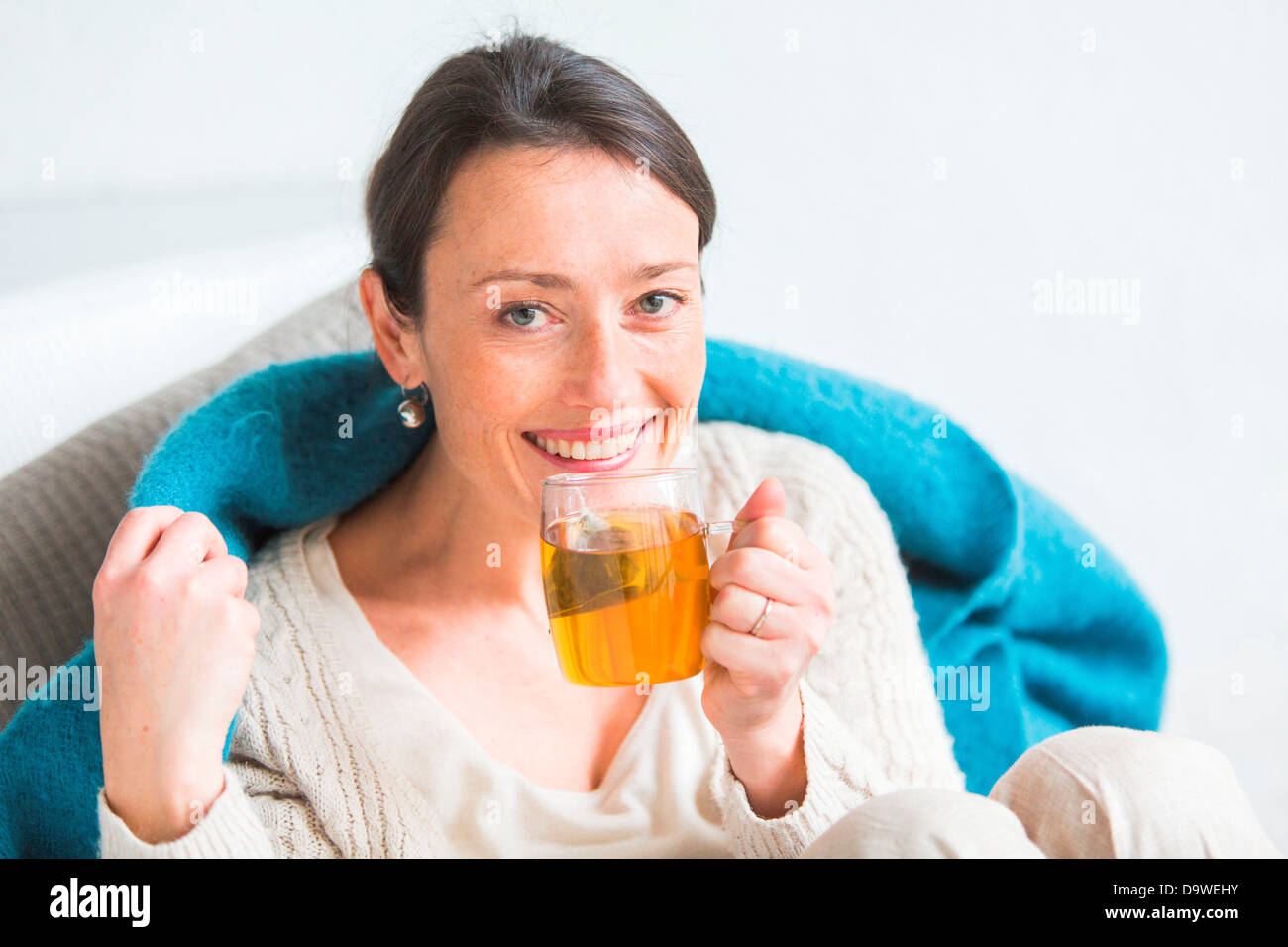 Woman drinking hot beverage Stock Photo Alamy