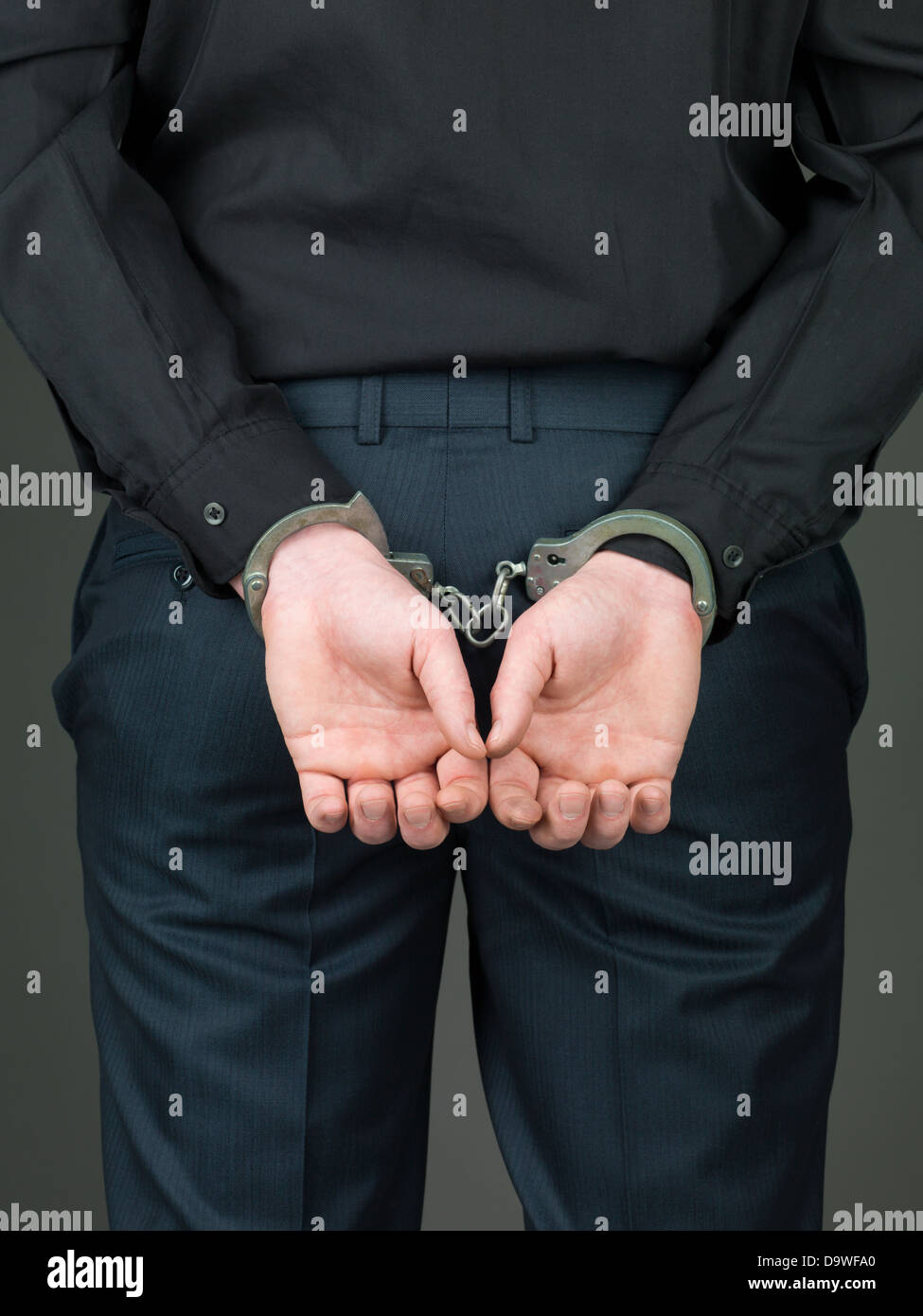 Handcuffed behind his back hires stock photography and images Alamy