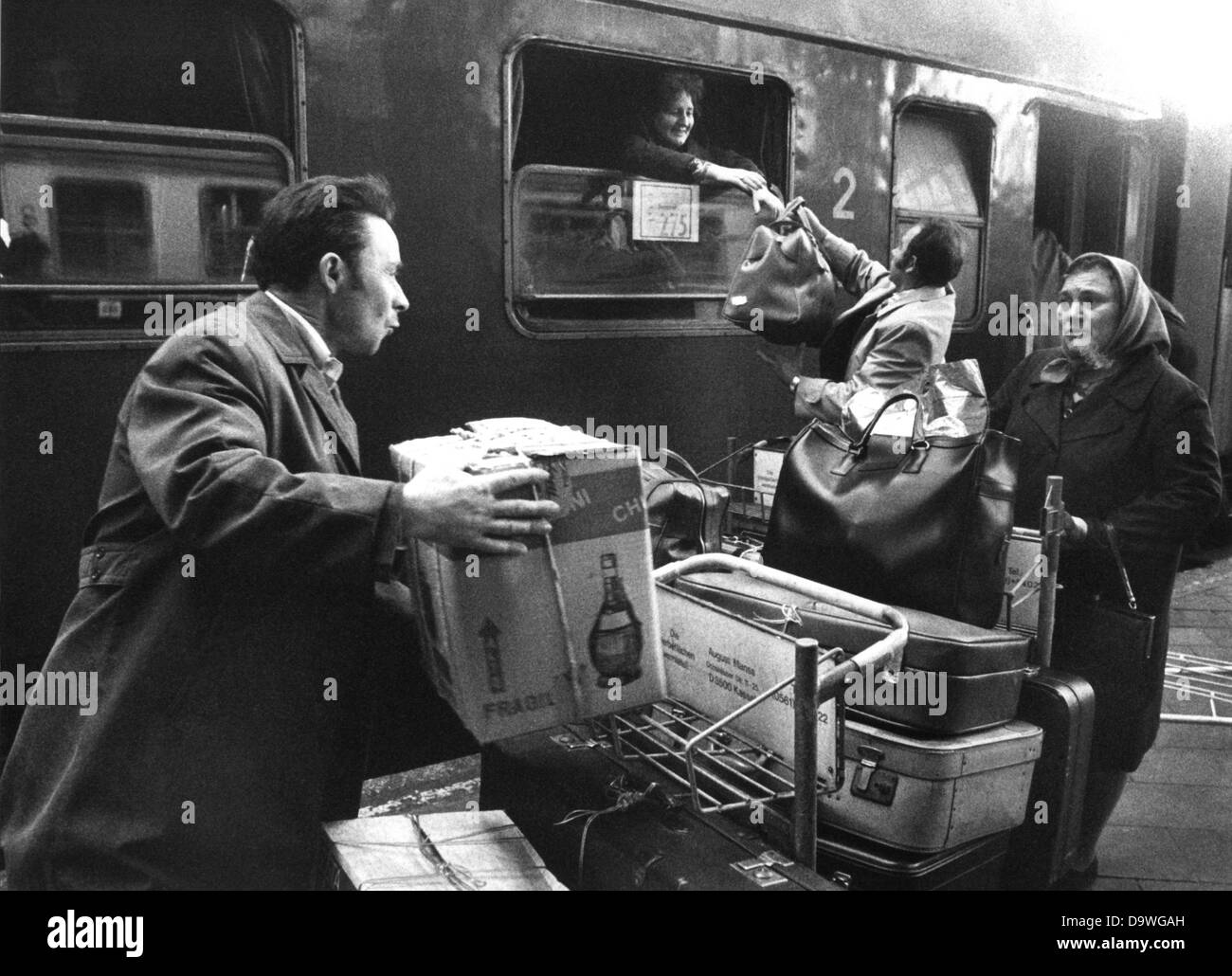 Turkish guestworker return to their homecountry and load their luggage into the Istanbul express at Frankfurt central station on the 14th of April in 1977. Stock Photo