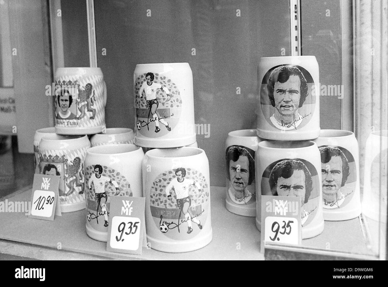 Beer mugs with the picture of soccer national player Franz Beckenbauer in a shop window on the 3rd of May in 1977 in Munich. Stock Photo