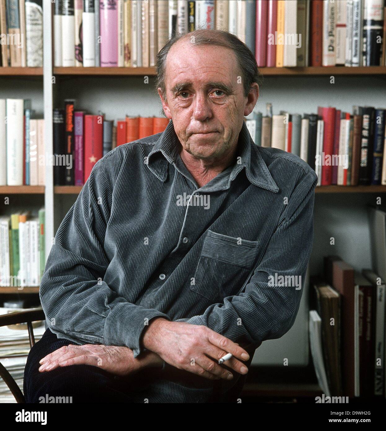 Writer Heinrich Böll in his apartment in Cologne in December 1977. Stock Photo