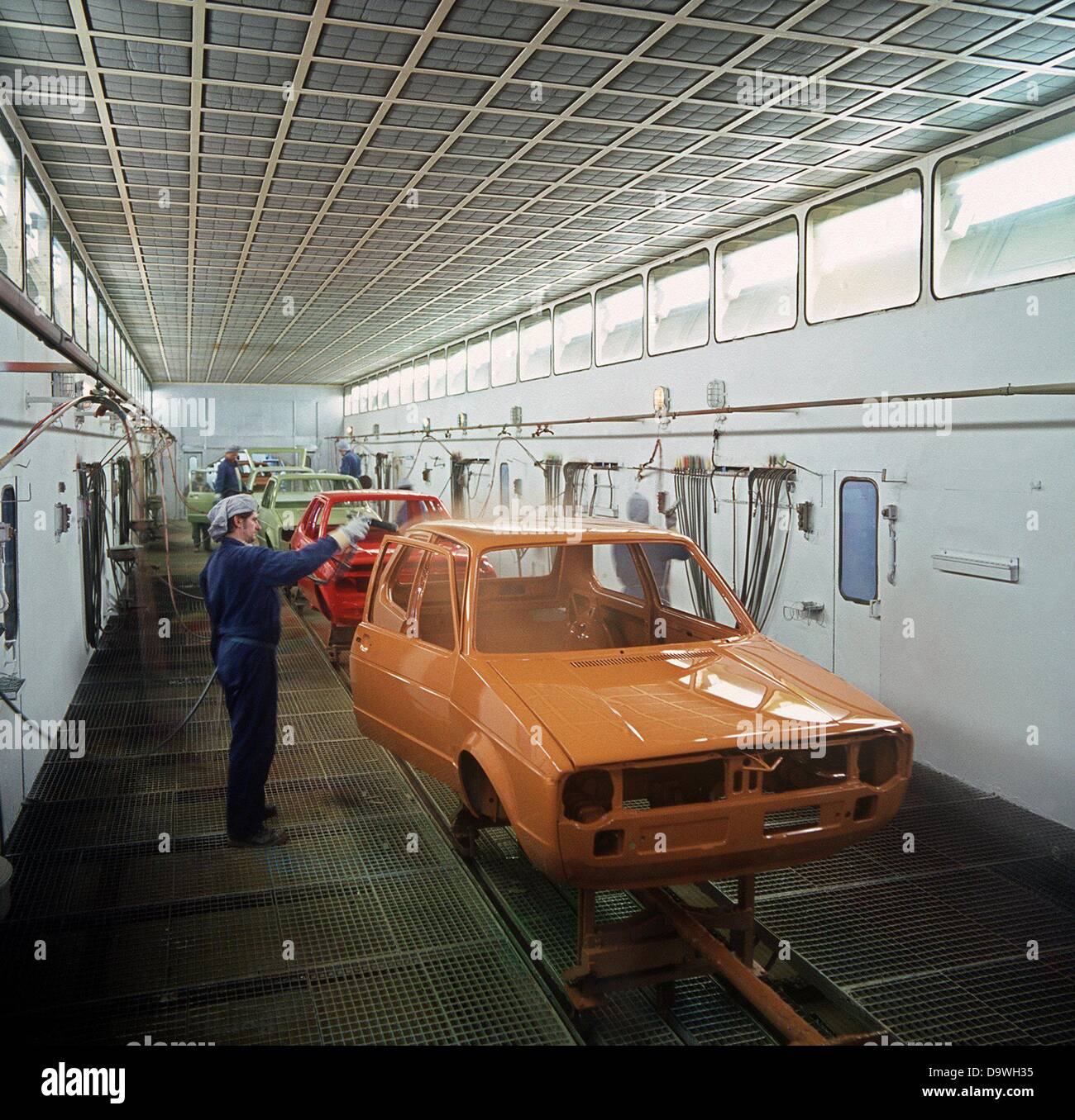 The VW Golf is varnished in all sorts of colours by hand at the Volkswagen factory, photographed in 1976. Stock Photo