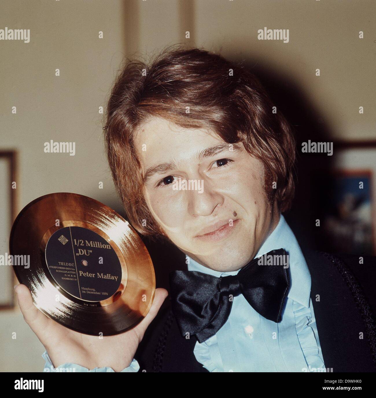 German rock singer Peter Maffay poses with his Golden Record on the 6th 