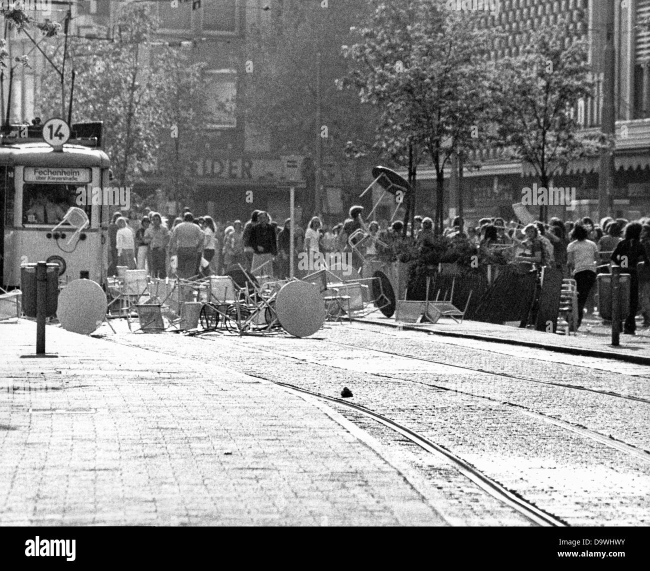 Demonstrators block the rails and throw furniture of a street cafe at a tram on the Zeil in Frankfurt am Main. Demonstrators and police have one of the 'most brutal conflicts' in the last years on the 10th of May in 1976 in Frankfurt am Main during a forbidden protest march on the occasion of anarchist Ulrike Meinhof's suicide. About 600 demonstrators threw Molotov cocktails and stones at the police. More than a dozen of police men were injured, seven demonstrators were arrested Stock Photo