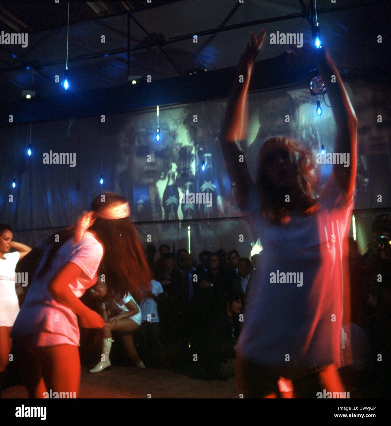 Go-go girls dance in a beat discotheque in Duesseldorf in the 1970s. Stock Photo