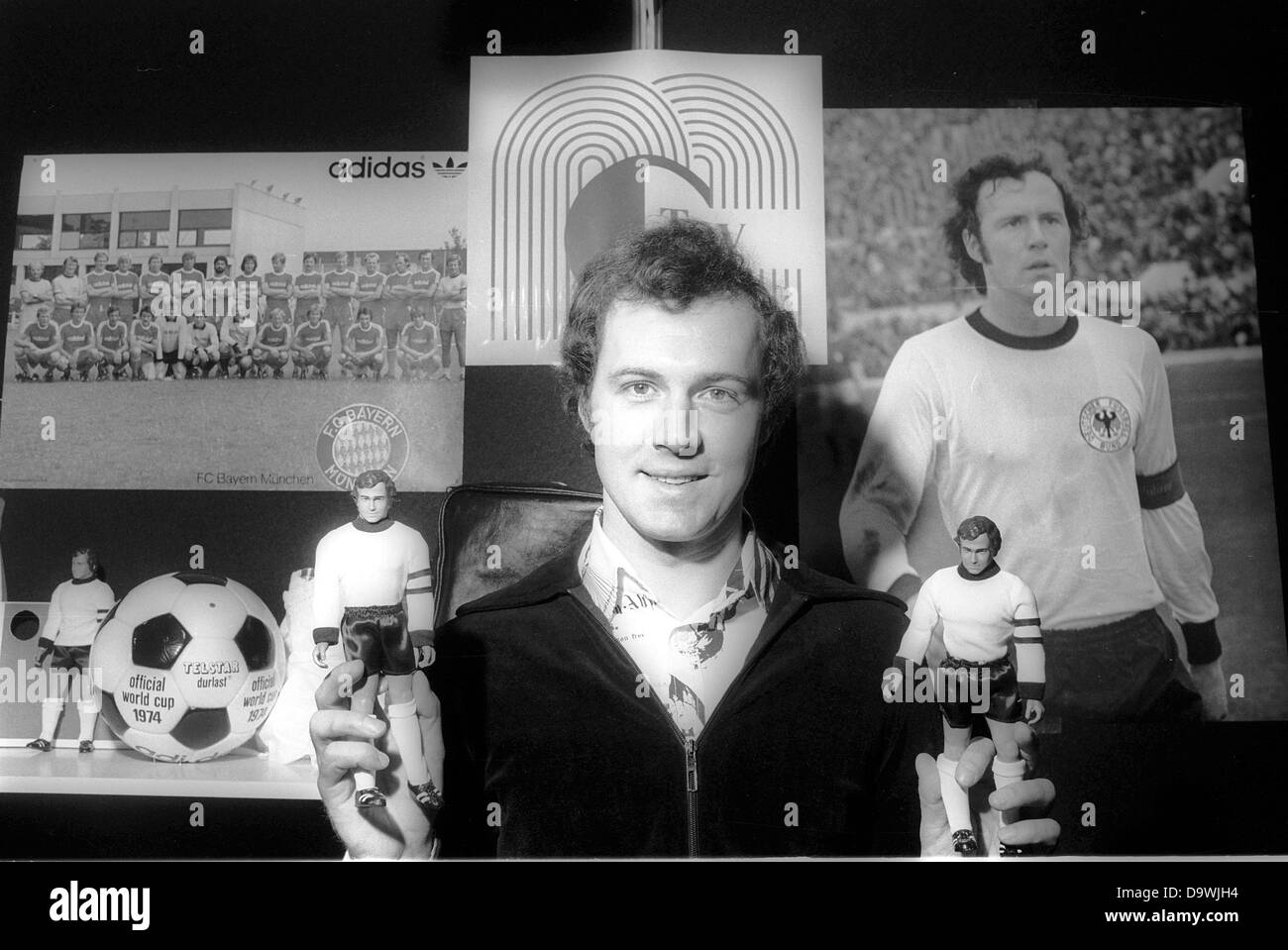 German soccer national player Franz Beckenbauer presents two toy puppets in soccer dress at the toy fair in Nuremberg on the 9th of February in 1977. Stock Photo