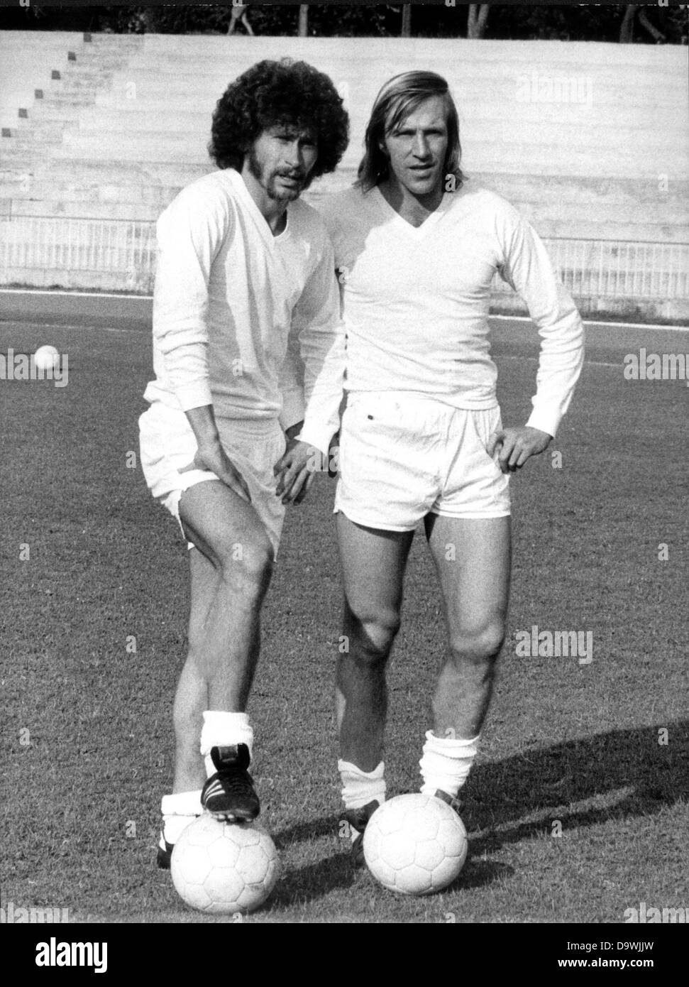 German players Paul Breitner (l) and Günter Netzer (r) play for Real Madrid, photographed on the 27th of August in 1974 in Madrid. Stock Photo