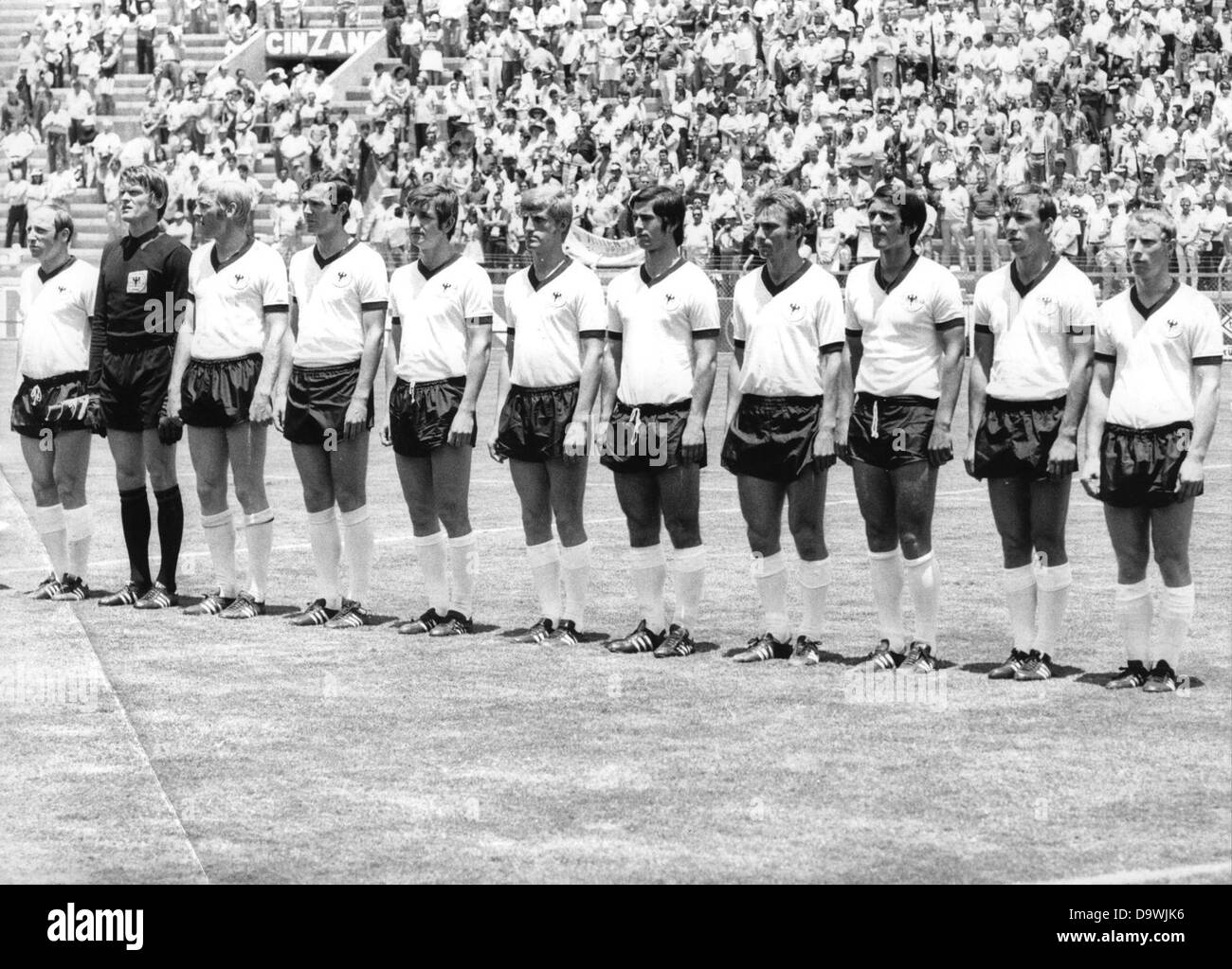 The German national team takes position for the hymns before the group match against Bulgaria on the 7th of June in 1970 in Leon at the World championships. The picture shows (l-r) Uwe Seeler, Sepp Maier, Karl-Heinz Schnellinger, Franz Beckenbauer, Johannes Löhr, Klaus Fichtel, Gerd Müller, Reinhard Libuda, Wolfgang Overath, Horst-Dieter Höttges and Berti Vogts. Stock Photo