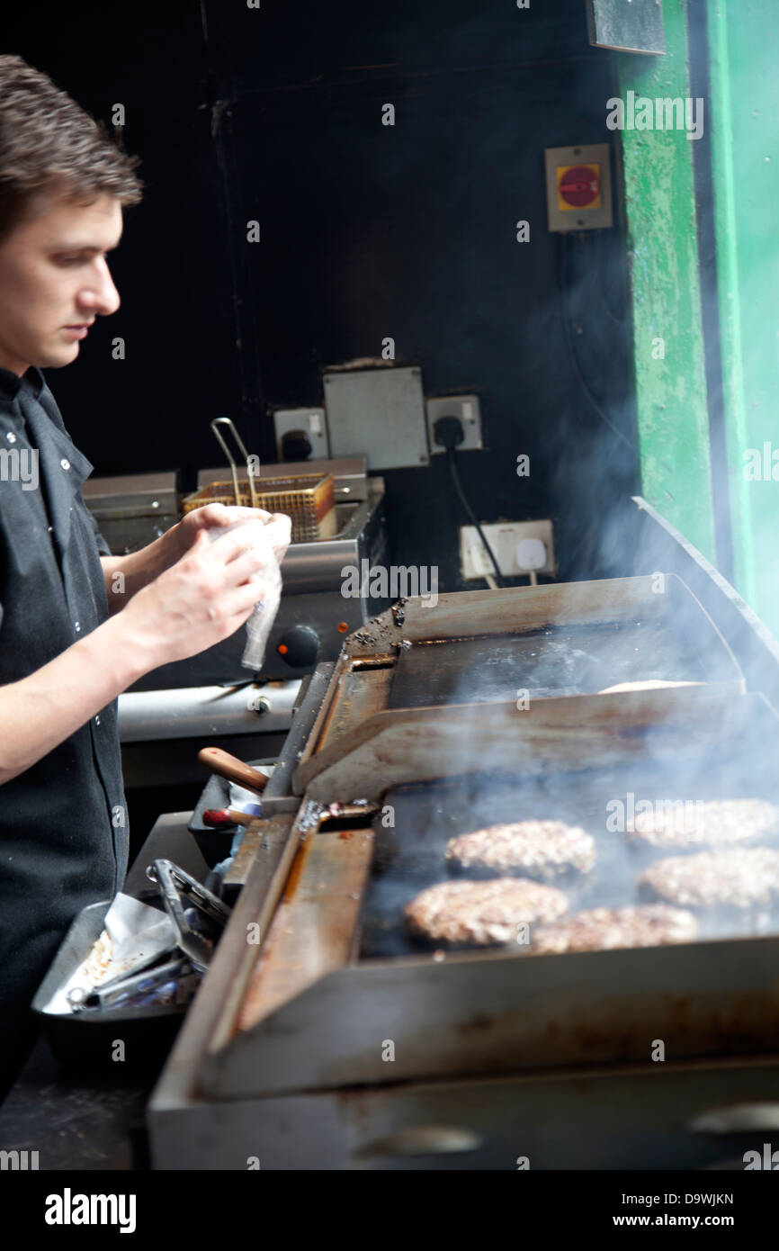 Grilling Hamburger Patties - Food Stall at Borough Market - London UK Stock Photo