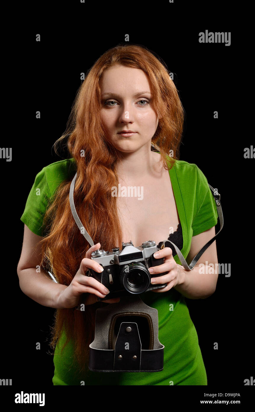 Pretty woman with a vintage camera Stock Photo