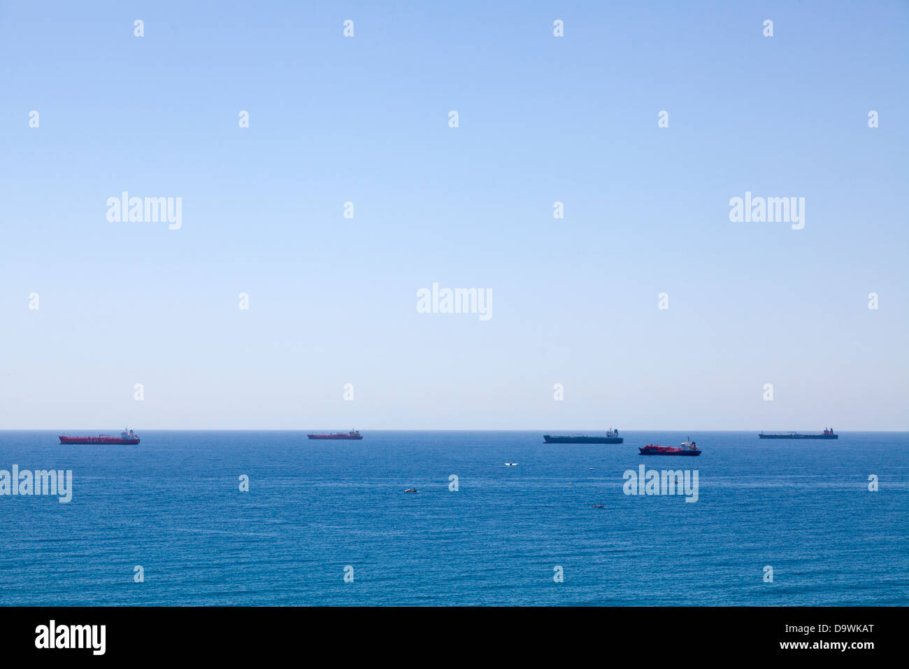 Tankers and container ships passing off Tarragona in the Mediterranean. Stock Photo
