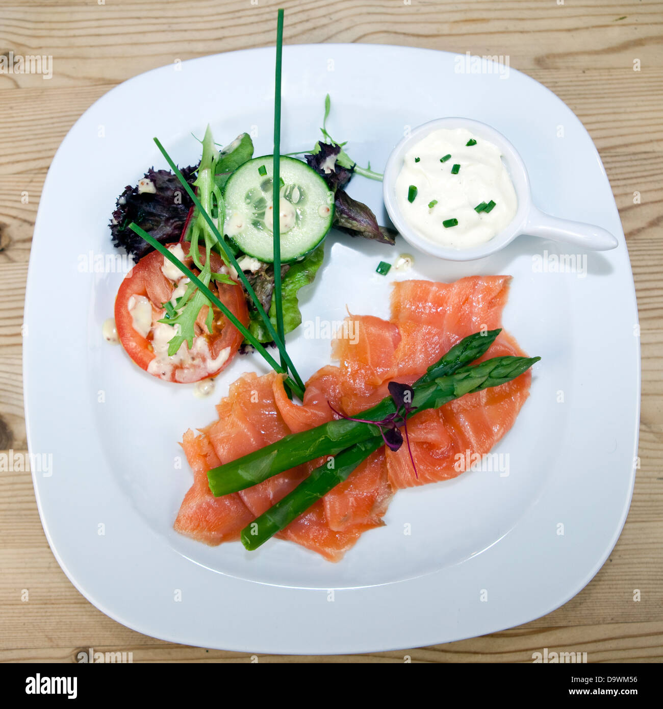 Salmon with asparagus and salad Stock Photo