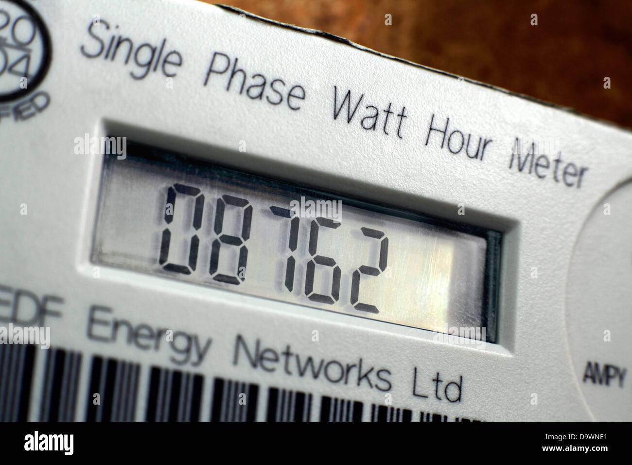 Close up of an electricity meter in a house, showing the number of watts of electricity used. Stock Photo