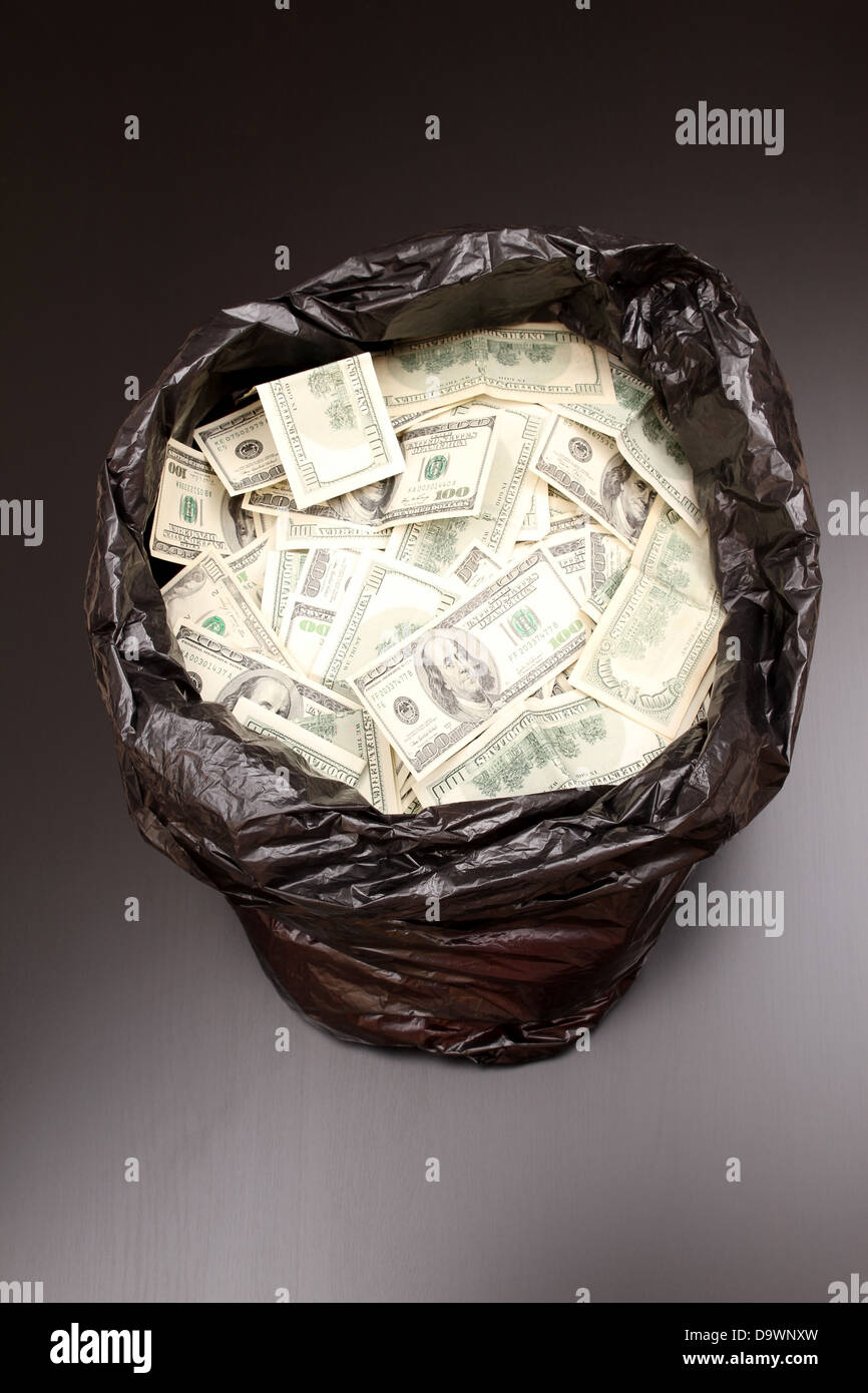 A Rubbish bag full of dollars Stock Photo Alamy