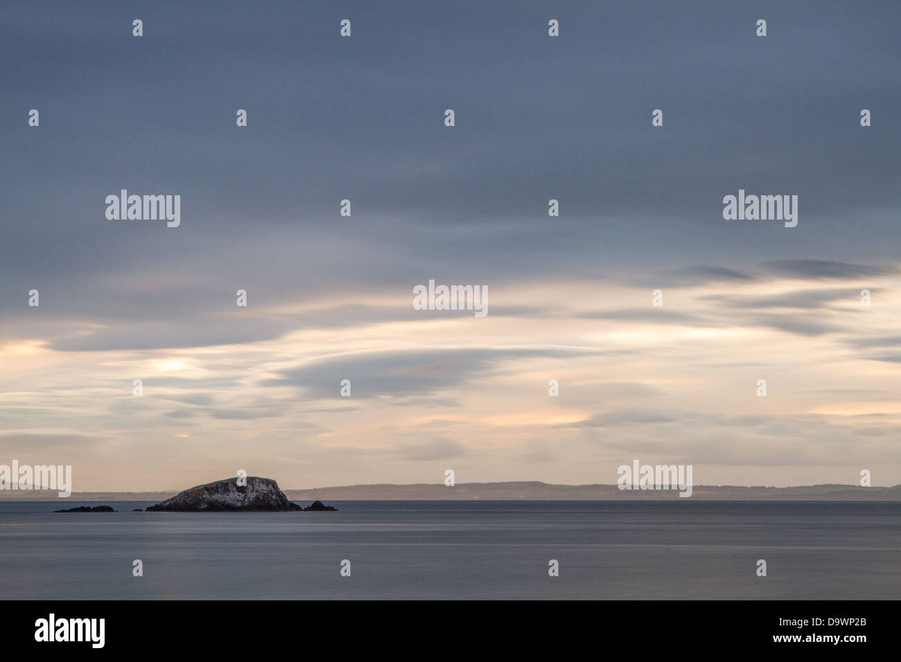An island of the North Berwick coastline on a long exposure at dusk Stock Photo