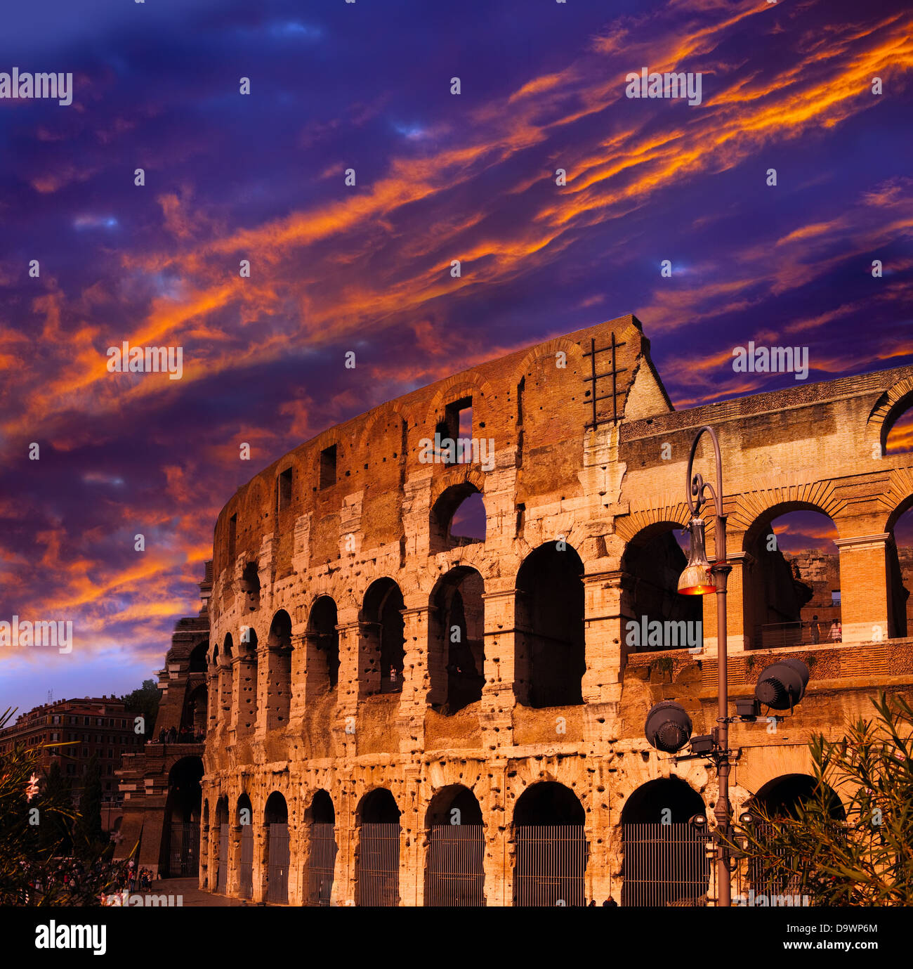 Bright crimson sunset over the ancient Colosseum. Rome. Italy Stock Photo