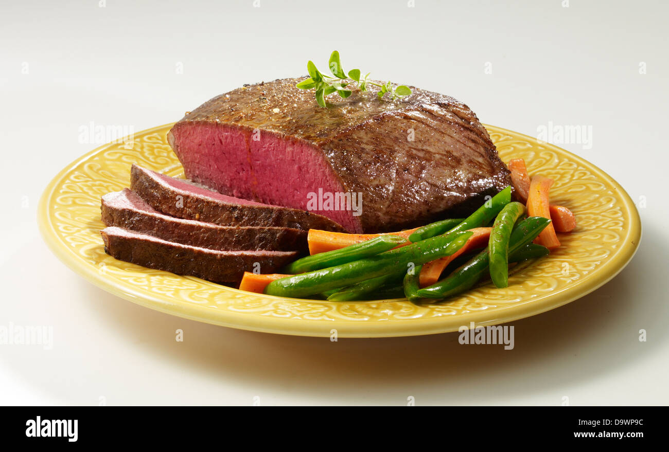 top round roast netted Stock Photo