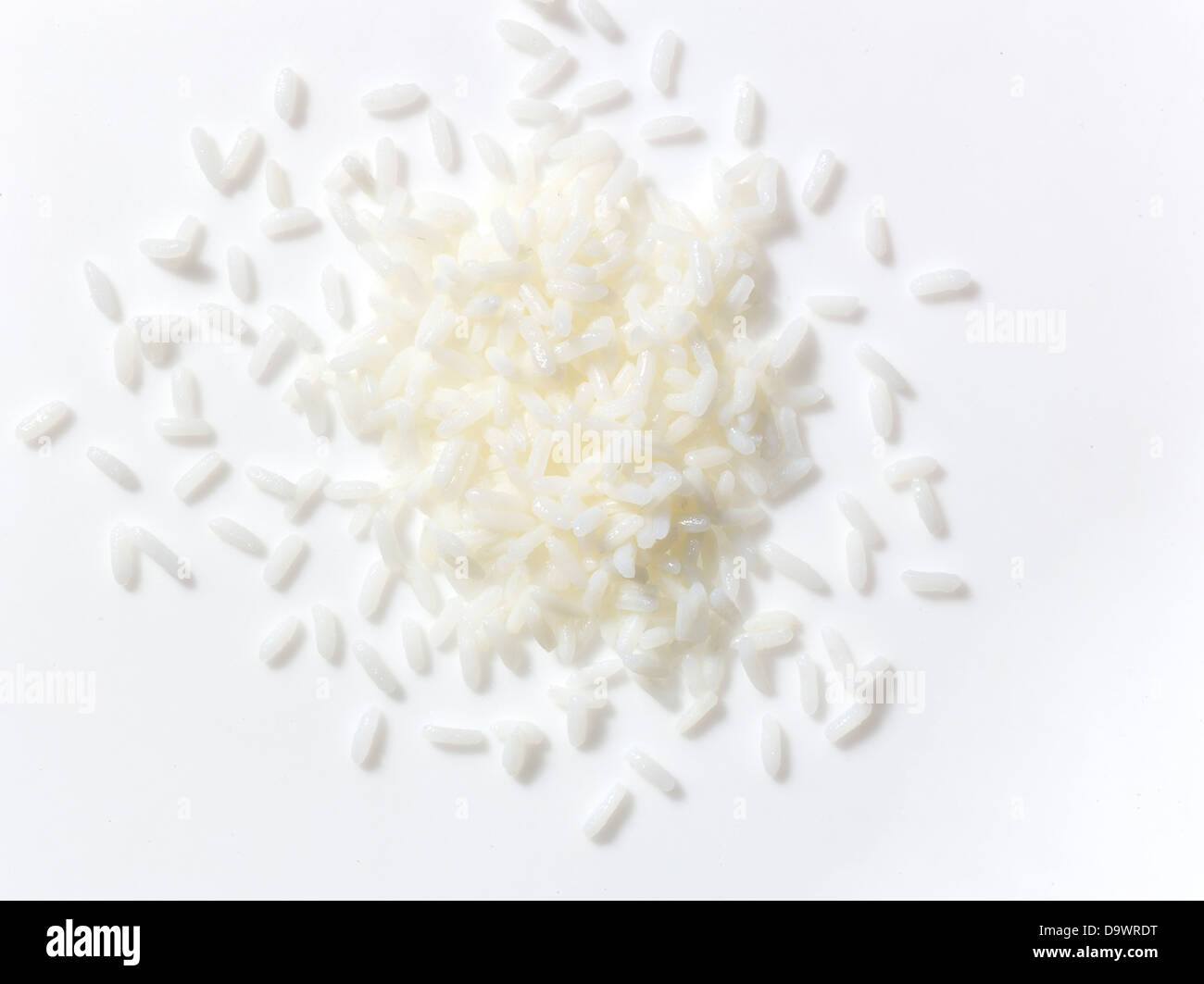 White rice one white surface Stock Photo