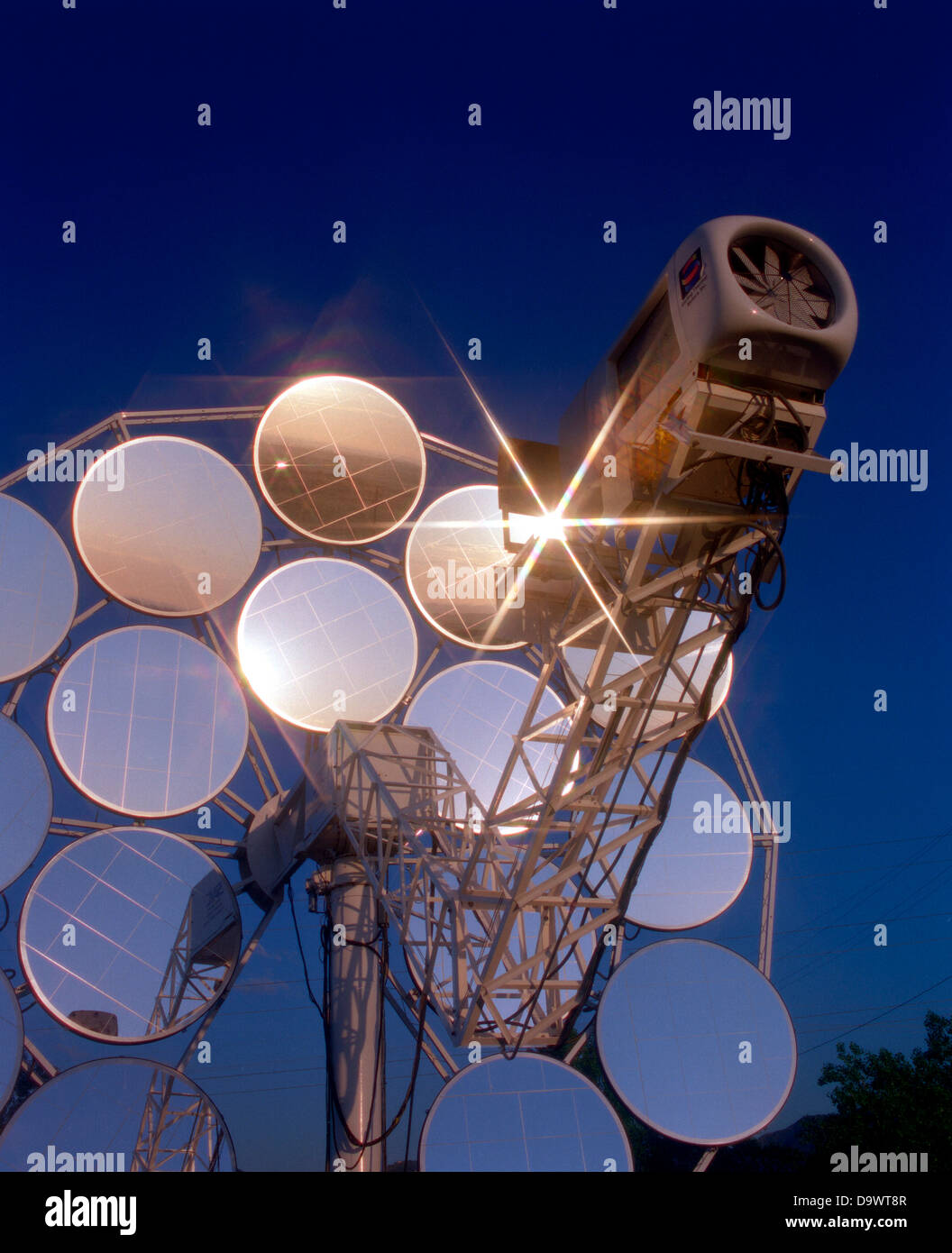 Stirling Solar power systems solar dish engine June 12, 1996 in Golden, Colorado. The dish produces electricity uses mirrors to focus sunlight onto a thermal receiver. The heat is used to run a Stirling heat engine, which drives an electric generator. Stock Photo