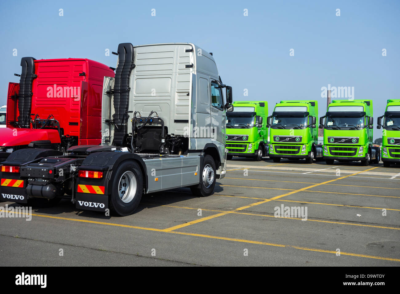 Trucks from the Volvo Trucks assembly plant waiting to be loaded on roll-on/roll-off / roro ship at the Ghent seaport, Belgium Stock Photo