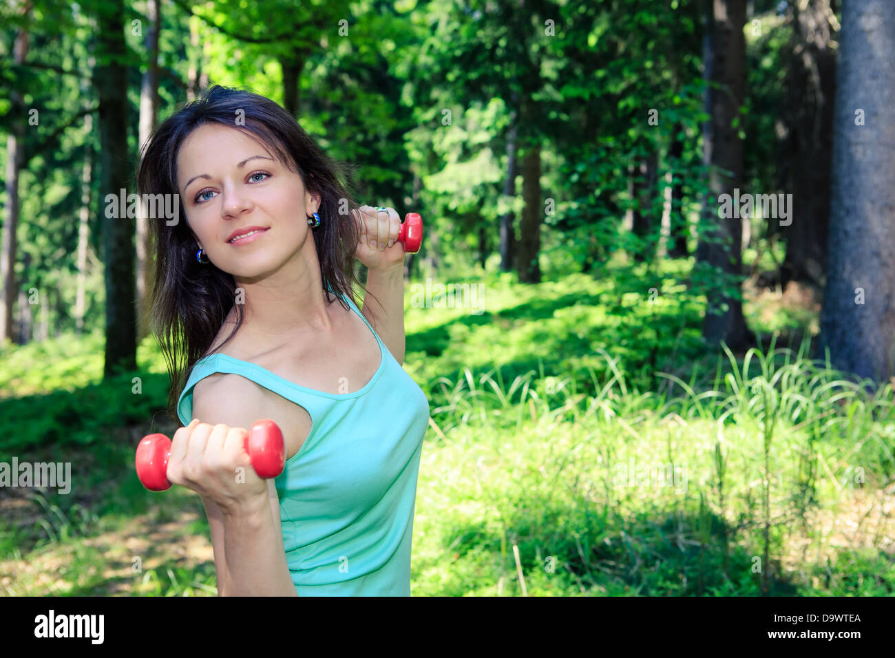 young woman jogging in a forest Stock Photo - Alamy