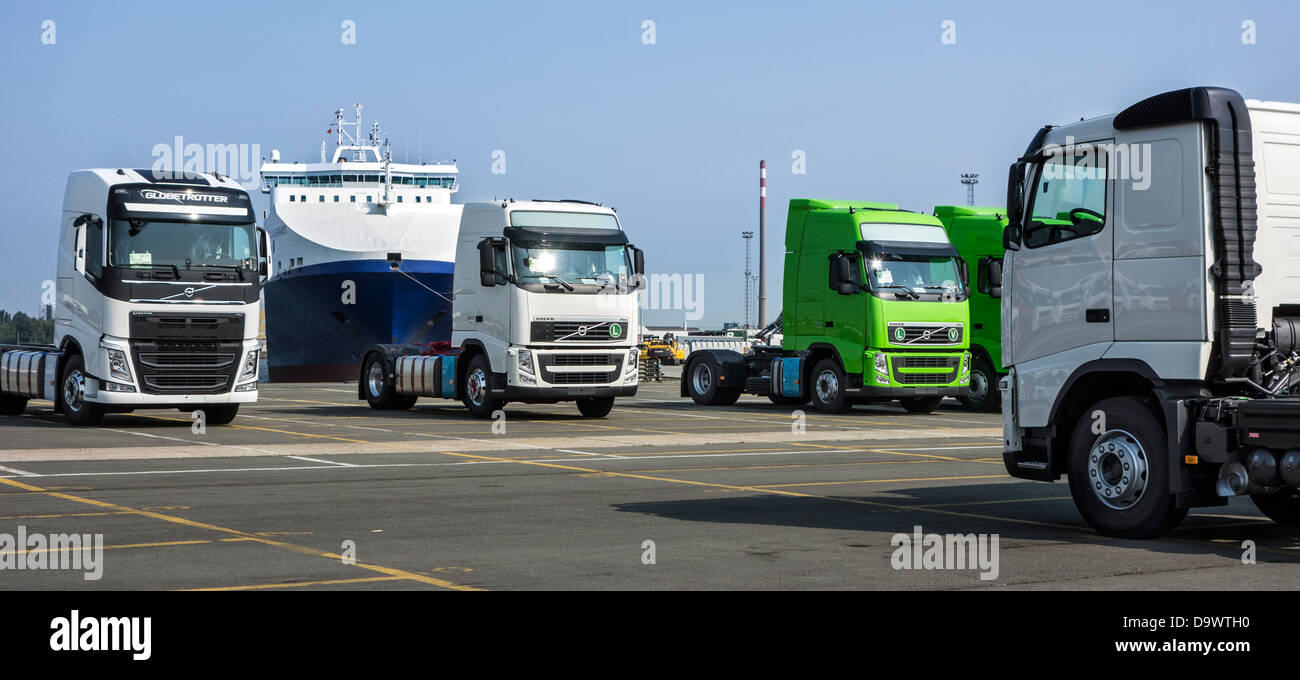 Trucks from the Volvo Trucks assembly plant waiting to be loaded on roll-on/roll-off / roro ship at the Ghent seaport, Belgium Stock Photo
