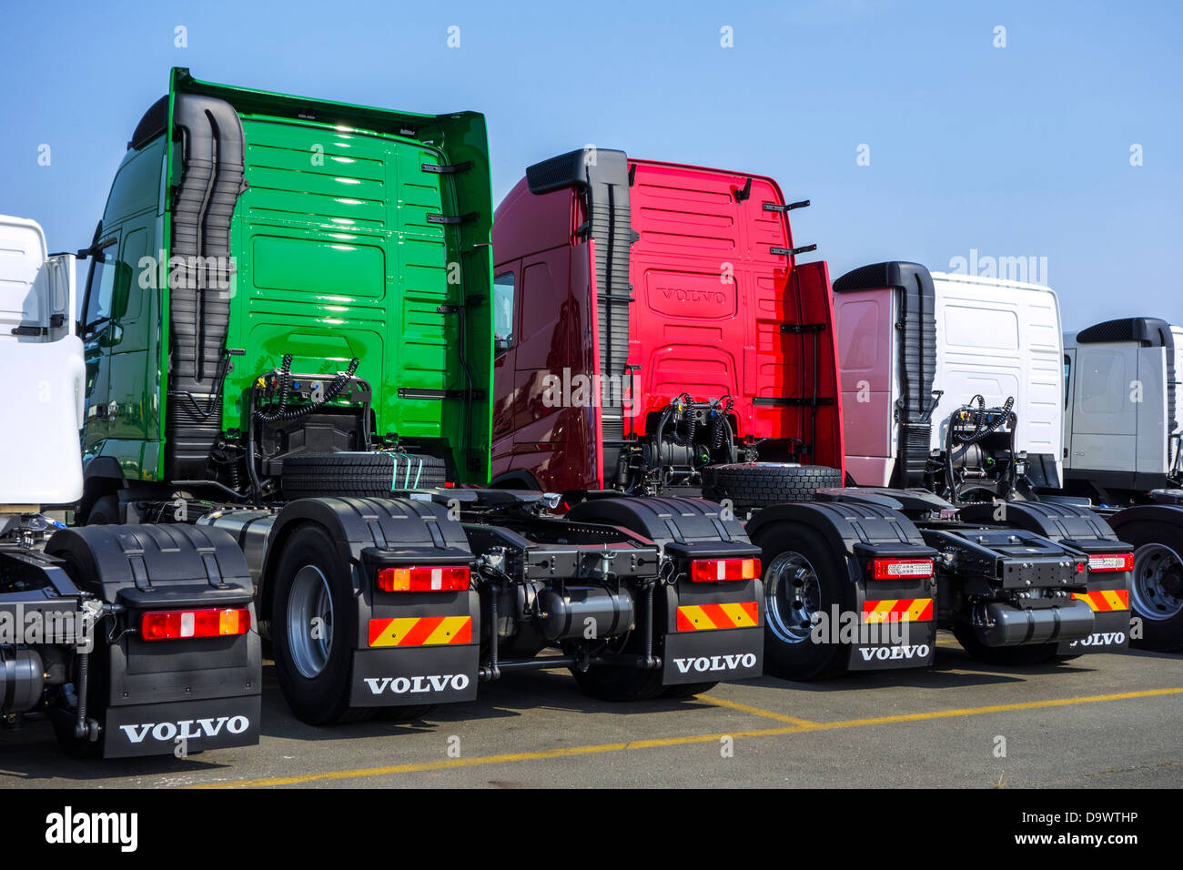 Trucks from the Volvo Trucks assembly plant waiting to be loaded on roll-on/roll-off / roro ship at the Ghent seaport, Belgium Stock Photo