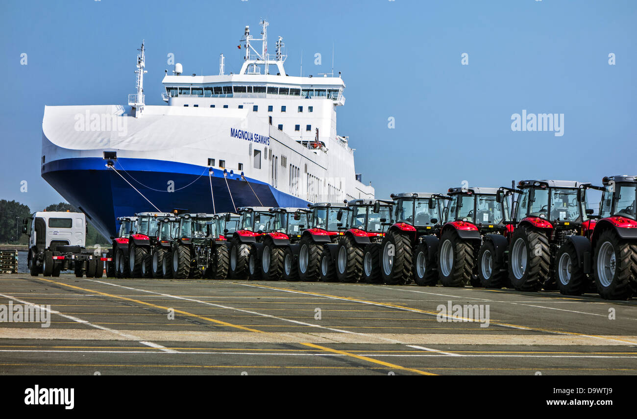 Tractors from the Volvo Trucks assembly plant waiting to be loaded on roll-on/roll-off / roro ship at Ghent seaport, Belgium Stock Photo