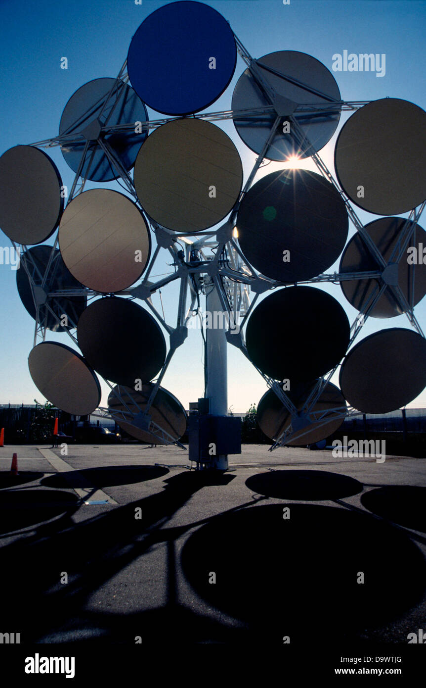 Stirling Solar power systems solar dish engine September 30, 1998 in Golden, Colorado. The dish produces electricity uses mirrors to focus sunlight onto a thermal receiver. The heat is used to run a Stirling heat engine, which drives an electric generator. Stock Photo