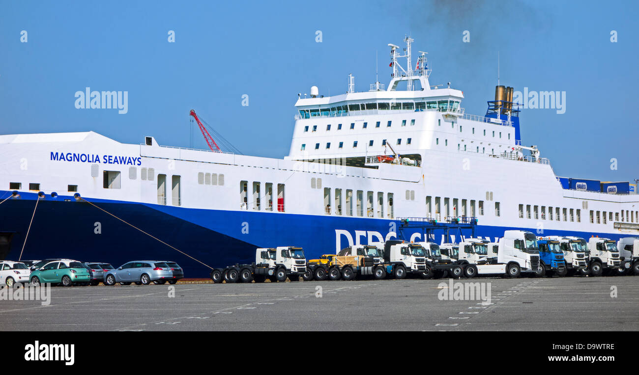 Trucks and cars from the Volvo assembly plant waiting to be loaded on roll-on/roll-off / roro ship at Ghent seaport, Belgium Stock Photo