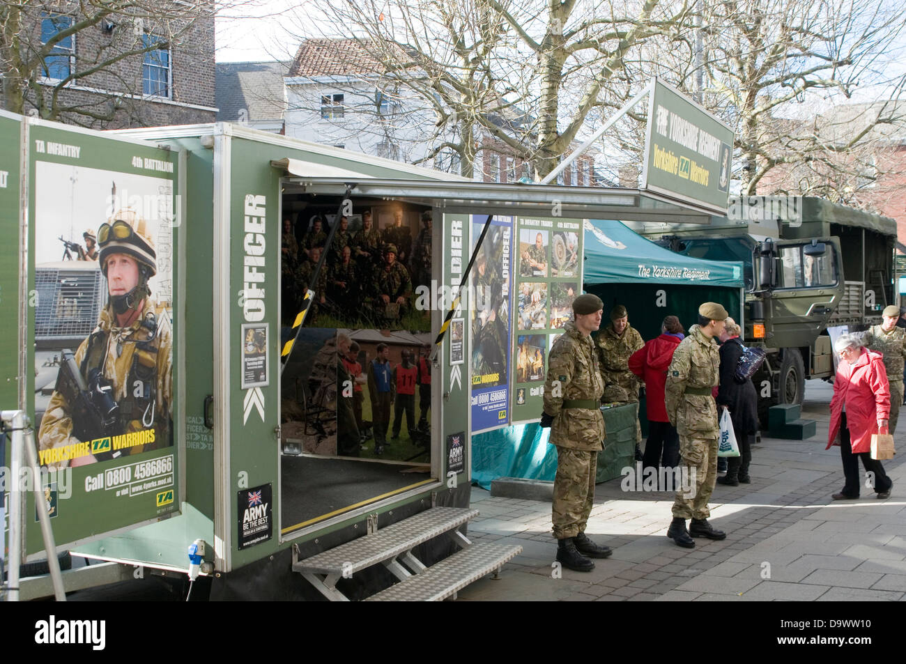 army recruitment stand recruiting soldiers solder officer display town center armed forces force signing up for military service Stock Photo