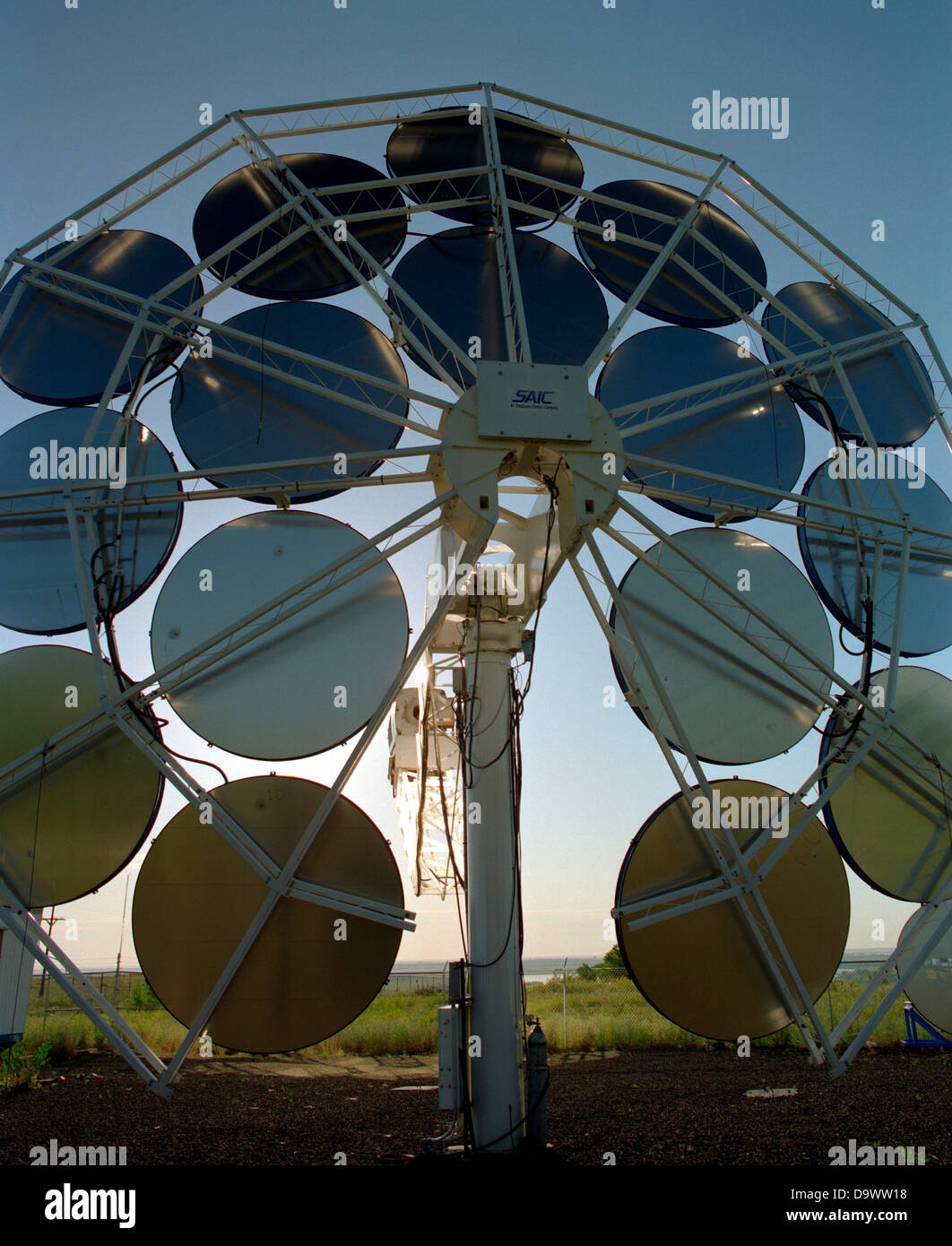 Stirling Solar power systems solar dish engine June 12, 1996 in Golden, Colorado. The dish produces electricity uses mirrors to focus sunlight onto a thermal receiver. The heat is used to run a Stirling heat engine, which drives an electric generator. Stock Photo
