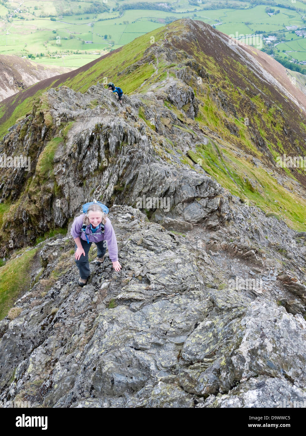 Scrambling near the top of Hall's Fell Ridge on Blencathra (aka Saddleback), a mountain in the English Lake District Stock Photo