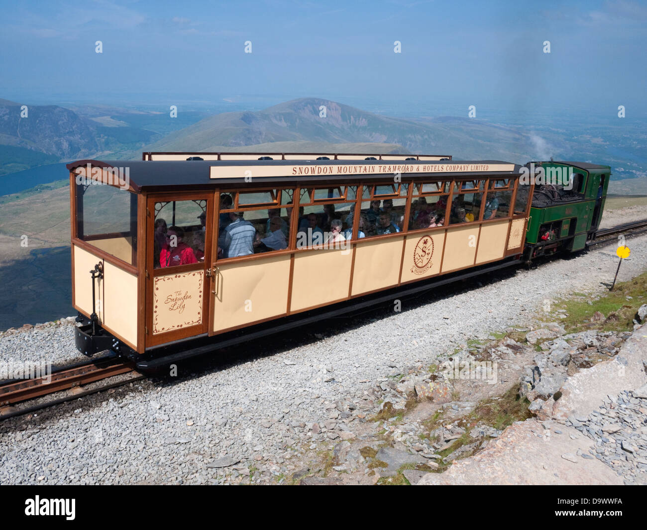 Snowdon Mountain Railway heritage carriage and steam locomotive 'Enid' on the final pull to the summit Stock Photo