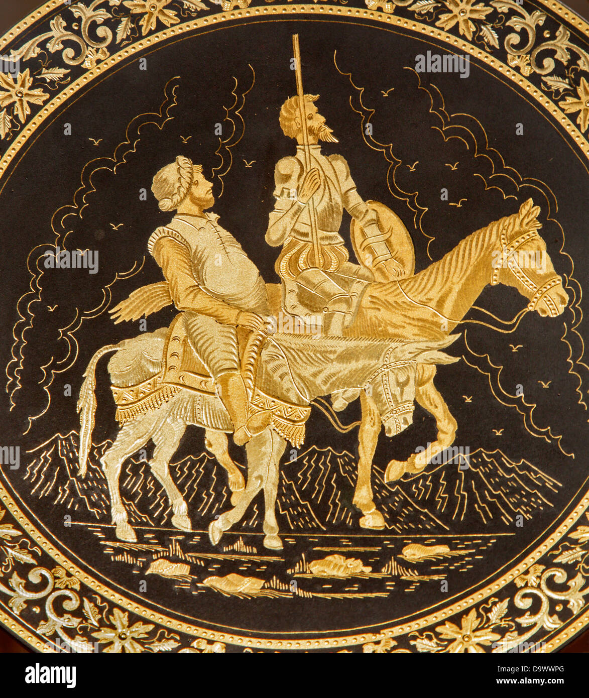 TOLEDO - MARCH 8: Detail of typical damascening plate with the Don Quixote and Sancho Panza. Stock Photo