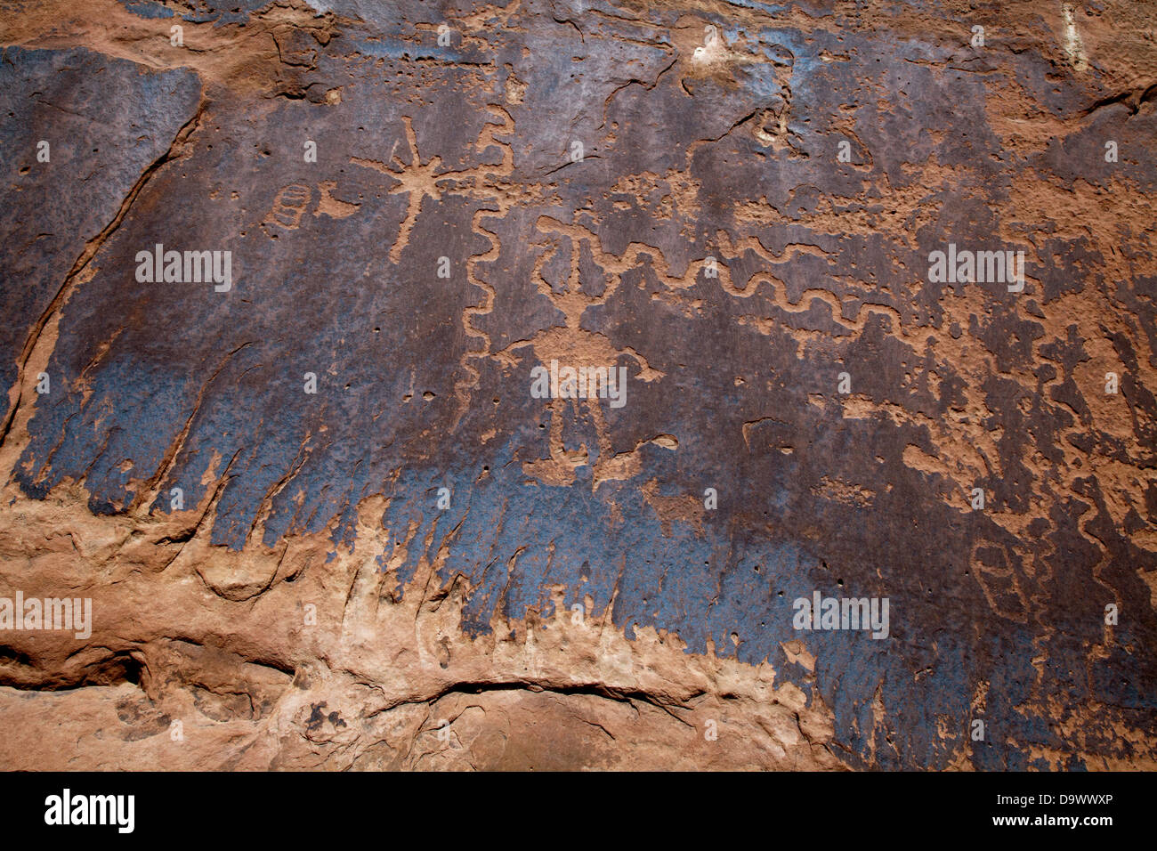 Prehistoric petroglyphs in a small side canyon along the Colorado River, downstream from Moab, Utah. Stock Photo