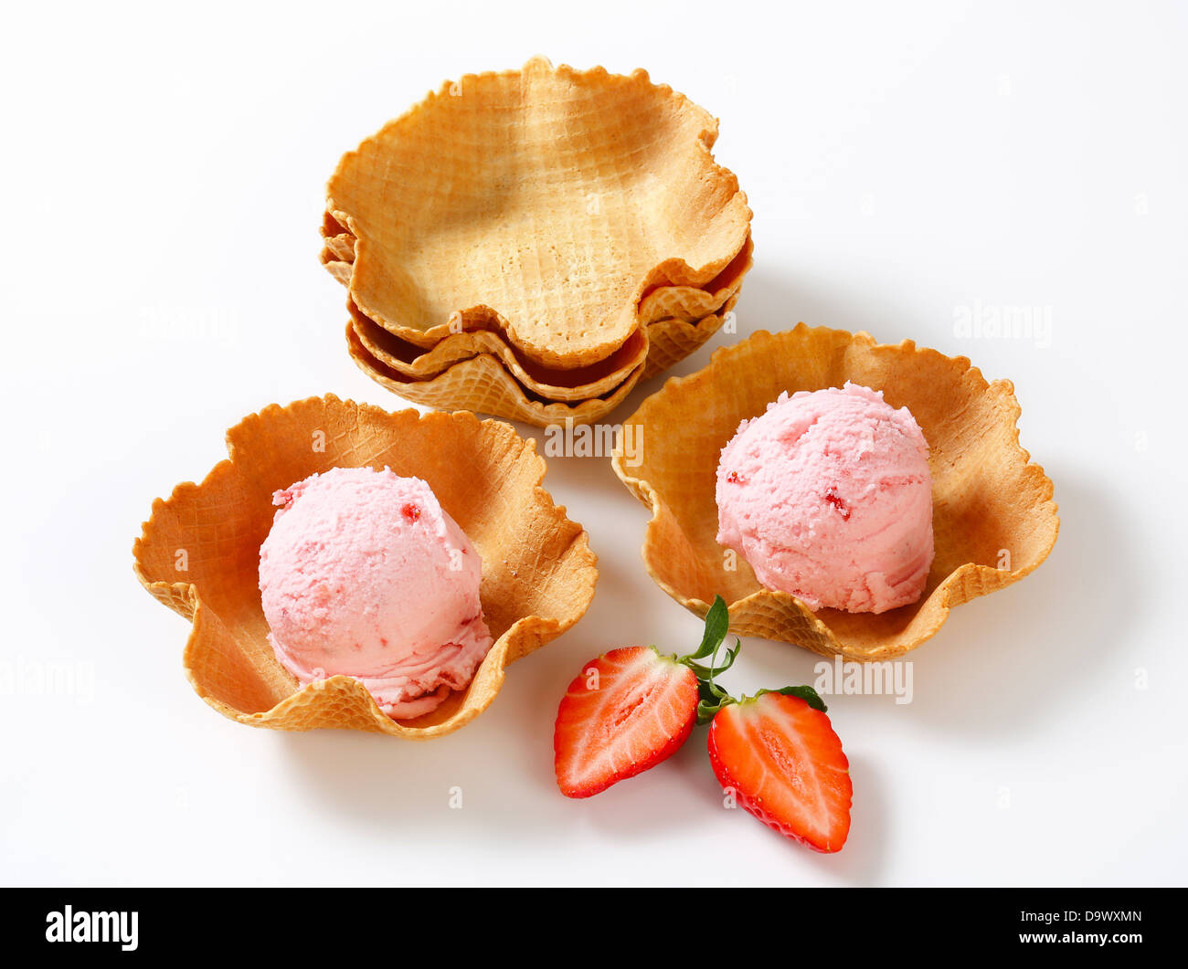 Scoops of strawberry ice cream in waffle baskets Stock Photo