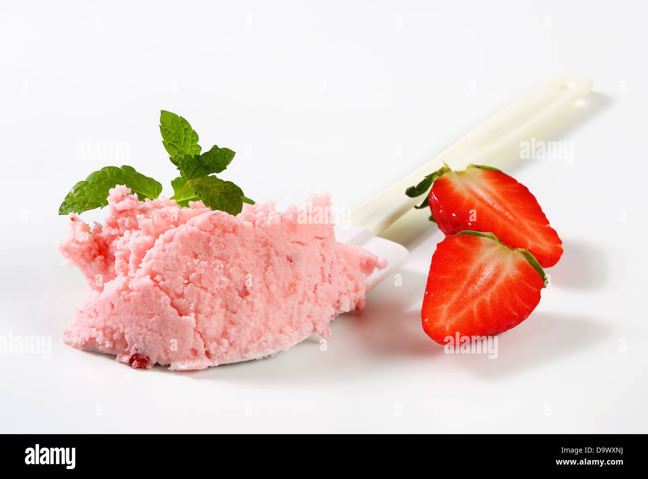 Strawberry ice cream on kitchen spatula Stock Photo