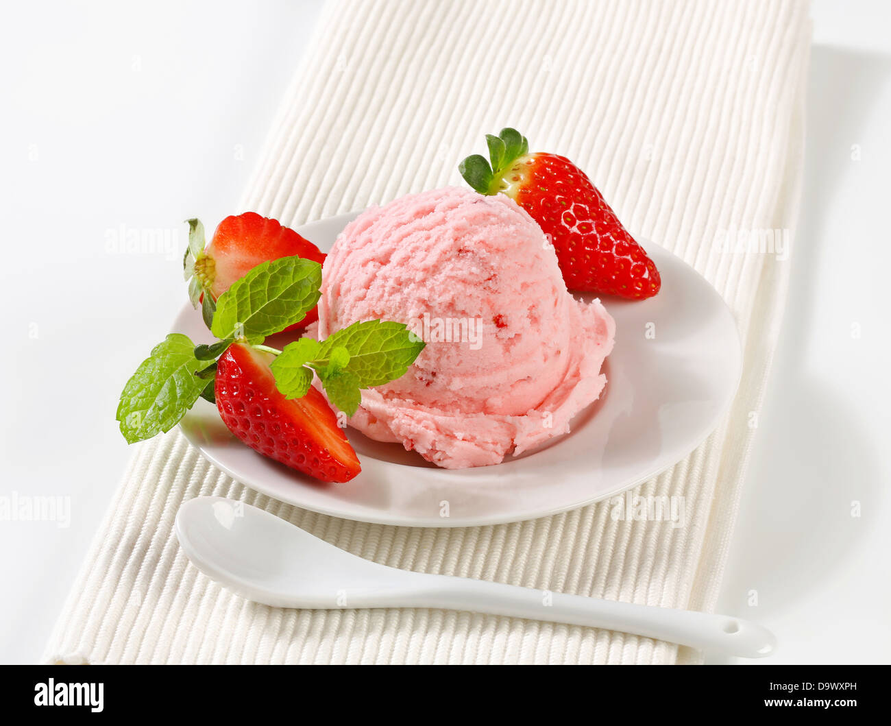 Scoop of strawberry ice cream - studio shot Stock Photo